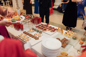 beautiful catering with people around the table