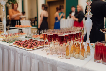 beautiful catering with people around the table