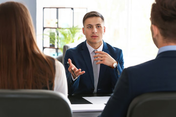 Human resources commission interviewing man in office