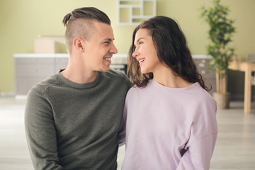 Adorable loving couple at home