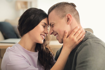 Adorable loving couple at home