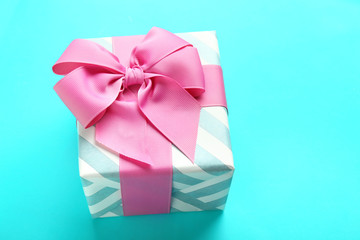 Beautiful gift box on color background