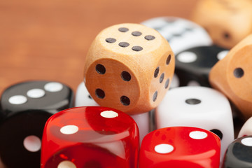 Dice on a wooden table. Concept for business risk.