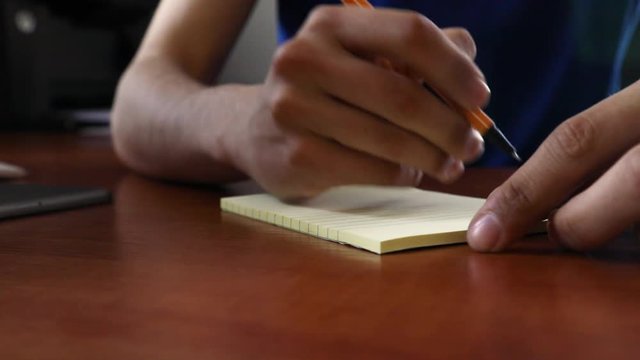 worker writes on tear-off sticker shot on 5d mark 4 UHD