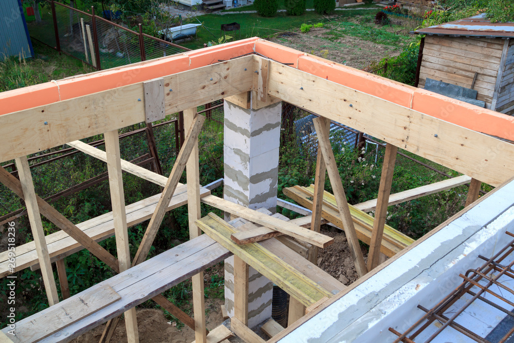 Poster view of wooden formwork with holders, which will be filled with overlap between floors in country ho