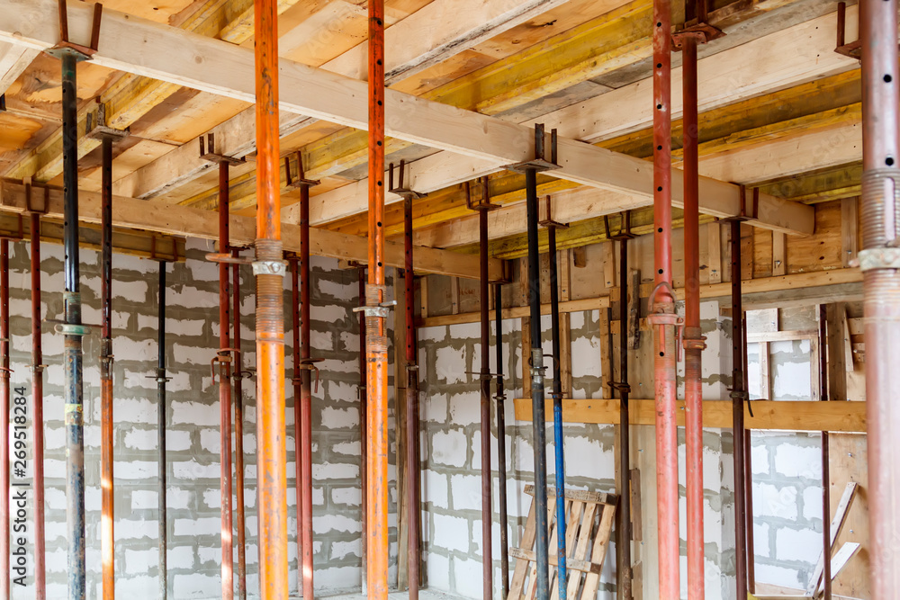 Poster view of wooden formwork with metallic holders, which will be filled with overlap between floors in c