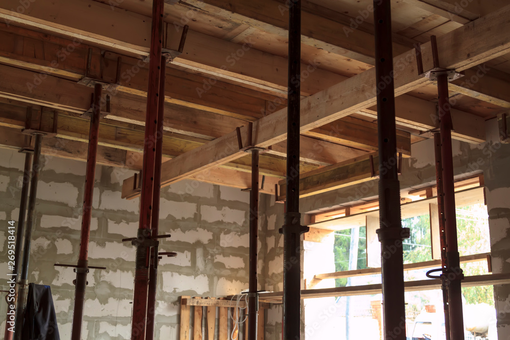 Poster view of wooden formwork with metallic holders, which will be filled with overlap between floors in c