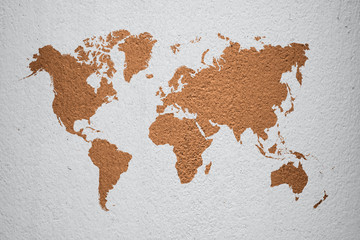 world map on brown cement wall background