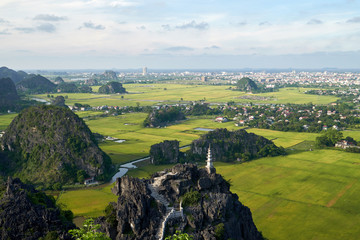 Panoramic view from the top of Mua mountain to a beautiful rock landscape of Ninh Binh and Tam Coc river in Vietnam.