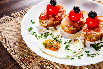 Breakfast - fried egg and sandwiches