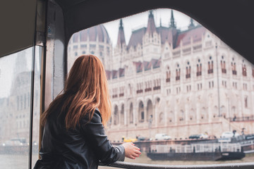 Tourism concept. Beautiful woman look at view of city streets, centre of city. Vacation in Budapest 