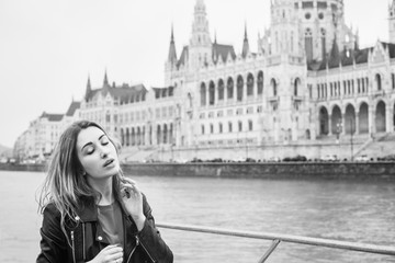 Fototapeta na wymiar Tourism concept. Beautiful woman look at view of city streets, centre of city. Vacation in Budapest 