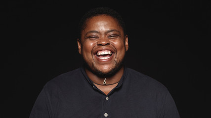 Laughing african transgender man - Powered by Adobe