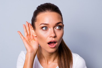 Close up photo beautiful amazing funky her she lady arm hand palm near ear try to hear news novelty open mouth chatterbox bad silly person wear casual white t-shirt isolated grey background