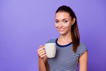 Portrait charming nice lady millennial striped t-shirt hold hand beverage hot smell feel confident cool independent content friendly fashionable expensive clothing isolated bright violet background 