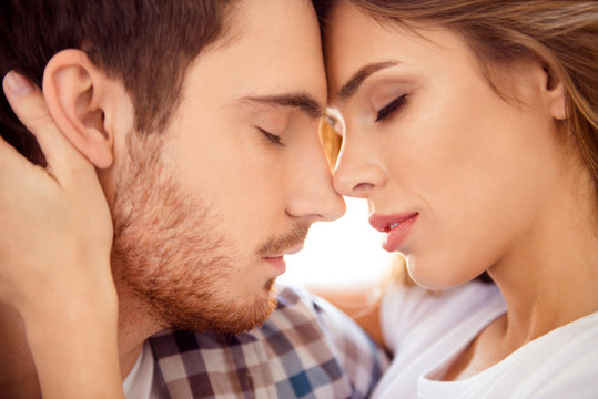 Close-up cropped portrait of his he her she nice-looking gorgeous attractive charming bearded guy caressing lady ideal match honey moon in light white style interior hotel house indoors