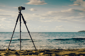 Camera taking picture film of sea coast