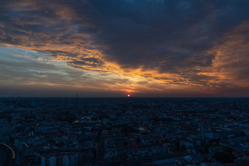 Berlin cityscape at sunset during a cloudy sky