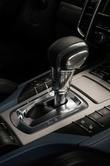Fototapeta na wymiar Modern car automatic transmission. Interior detail. Vertical photo.
