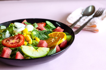 Selective focus Salmon Fresh green Salad with spinach, cherry tomatoes,baby spinach, Concept for a tasty and healthy meal. Dark stone background. Top view. Close up.