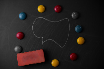 Round Flat shape stones with one eraser stick to old chalk black board
