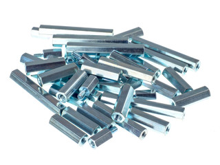 An assortment of iron standoffs or spacers