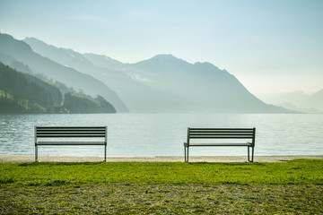 Two benches in small park at the shore of Lake Luzern