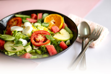 Selective focus Salmon Fresh green Salad with spinach, cherry tomatoes,baby spinach, Concept for a tasty and healthy meal. Dark stone background. Top view. Close up.