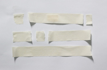 collection of white paper stickers on white background