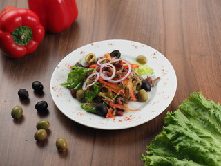 Salad with meat, olives, onions, beans and pepper