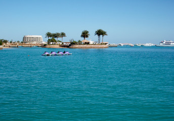 Relaxing view from the beach on a deep blue sea water. Red Sea, Hurghada Egypt