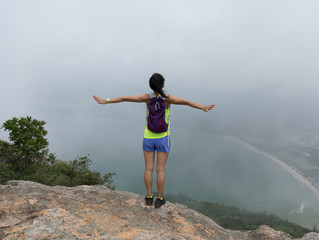 Successful Woman Hiker feel free In Seaside Mountain Top