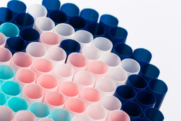 Abstract colorful background. Background from cocktail tubes close up. Soft focus. Cocktail tubes of different colors close up.Close-up of straw tubes.