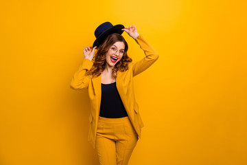 Portrait of nice charming cute attractive lovely gorgeous chic elegant smart gorgeous cheerful cheery wavy-haired lady trying on new individual look isolated on bright vivid shine orange background