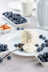 Cottage cheese with honey and blueberry.