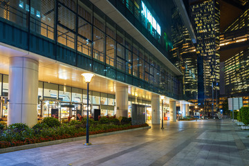 Shopping malls in business streets at night