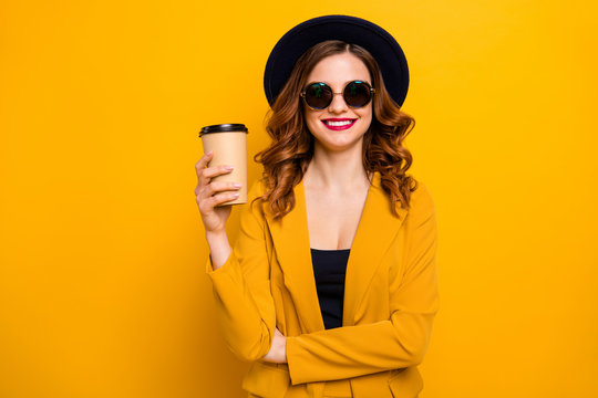 Close up photo beautiful dreamy she her lady vacation hot beverage takeout paper container hand arm white perfect teeth red pomade wear specs formal-wear suit isolated yellow bright background