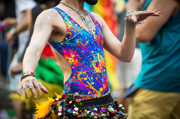 Close-up of an unrecognizable South Asian belly dancer in brightly colored costume with sequined...