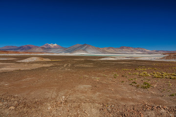 Red stones and Talar salar in Atacama