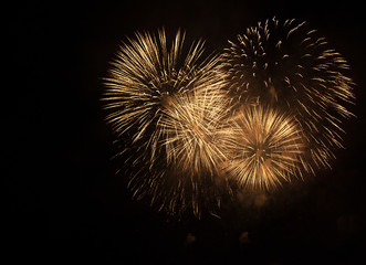 Bright salute in the black sky. Fireworks against the dark sky.