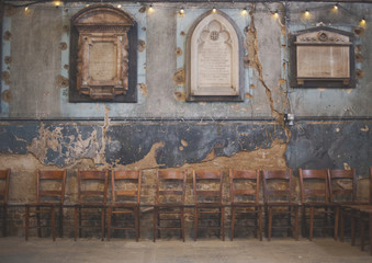 Derelict Wall and Chairs in Church Asylum