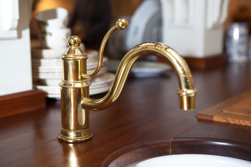 Retro style bathroom ,detail view of copper sink ,of retro design. Vintage bathroom decoration with faucet