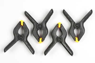 four black pegs on a white background