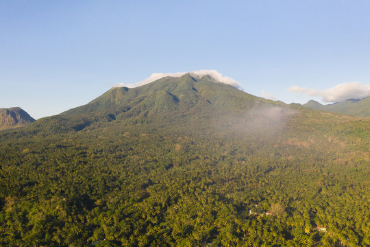 Mountain landscape on the island of Camiguin, Philippines. Volcanoes and forest. Hills and rainforest.