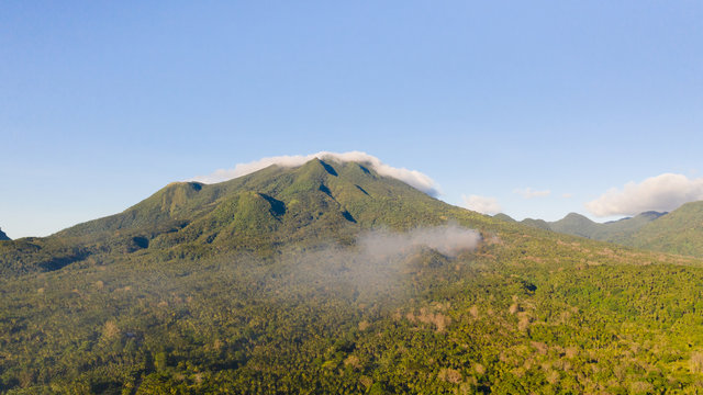 Mountain landscape on the island of Camiguin, Philippines. Volcanoes and forest. Hills and rainforest.