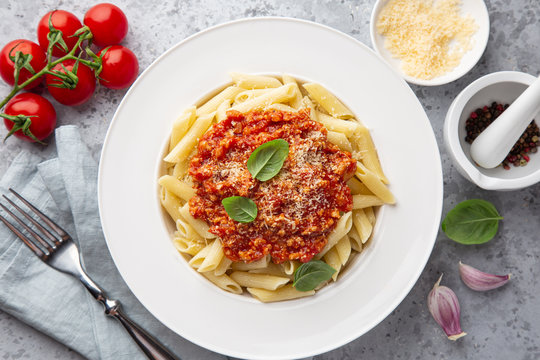 Penne Pasta With Bolognese Sause In White Plate