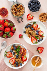 Healthy breakfast concept. Homemade granola, honey, yogurt and fresh berries.