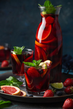 glass of homemade red wine sangria with fruits and berries
