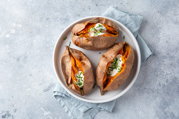 baked sweet potato with yogurt sause and chives