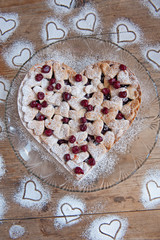 Cherry pie with heart shaped on the rustic background